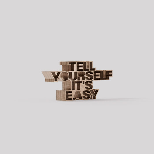 MANIFEST_Thought-Sculpture-tell-yourself-its-easy-LH2-Plain_BG_F7E4E8FF_RES250_20S_Wood_Bronze_1_1.jpg